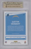 Justin Herbert from the 2020 Panini Donruss Optic set featuring a Green Velocity parallel graded by Beckett and given an overall grade of 9.5.