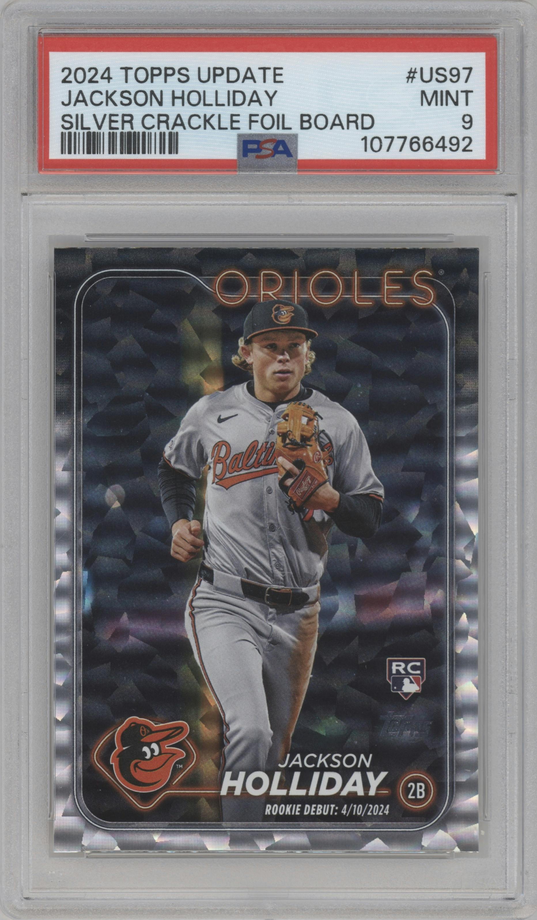 Jackson Holliday from the 2024 Topps Update set featuring a Silver Crackle Foilboard parallel graded by PSA and given an overall grade of 9.