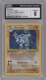 Machamp from the 1999 Pokemon set graded by CSG and given an overall grade of 8.