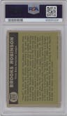 Brooks Robinson from the 1961 Topps set graded by PSA and given an overall grade of 7.