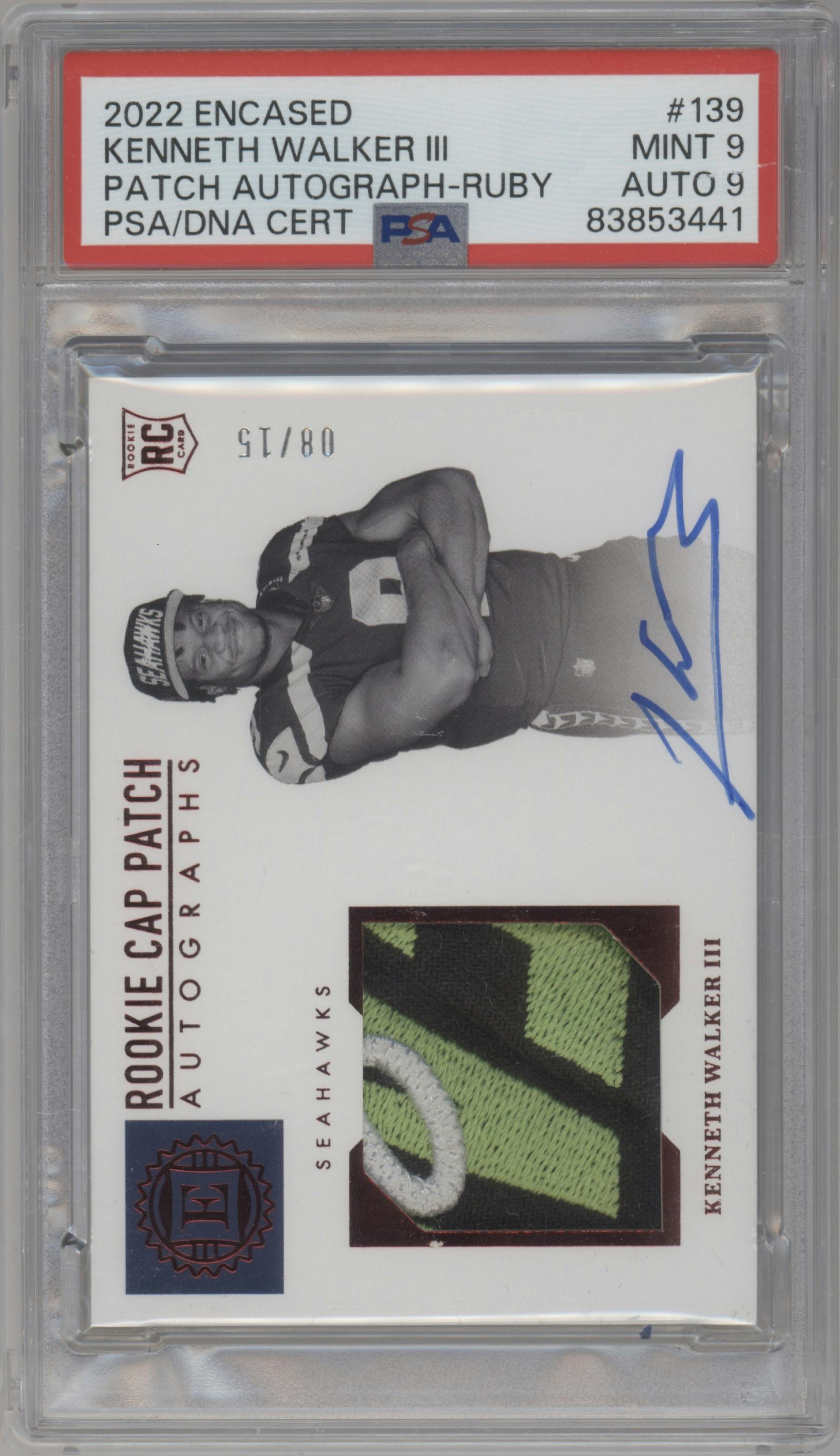 Kenneth Walker III from the 2022 Panini Encased set featuring a Ruby parallel graded by PSA and given an overall grade of 9.