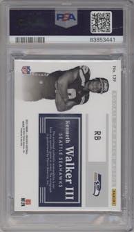 Kenneth Walker III from the 2022 Panini Encased set featuring a Ruby parallel graded by PSA and given an overall grade of 9.