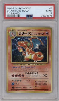 Charizard from the 1999 Pokemon JPN set featuring a CD Promo parallel graded by PSA and given an overall grade of 9.