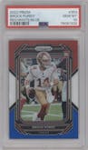 Brock Purdy from the 2022 Panini Prizm set featuring a Red/White/Blue Prizm parallel graded by PSA and given an overall grade of 10.