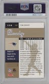 Tom Brady from the 2006 Fleer Ultra set featuring a Gold Medallion parallel graded by PSA and given an overall grade of 9.