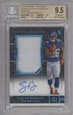 Saquon Barkley from the 2018 Panini National Treasures set featuring a Midnight parallel graded by Beckett and given an overall grade of 9.5.