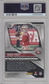 Brock Purdy from the 2024 Panini Prizm set featuring a Pandora parallel graded by PSA and given an overall grade of 9.