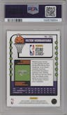 Victor Wembanyama from the 2023-24 Panini Haunted Hoops set featuring a Orange parallel graded by PSA and given an overall grade of 9.