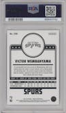 Victor Wembanyama from the 2023-24 Panini NBA Hoops set featuring a Winter parallel graded by PSA and given an overall grade of 10.