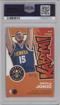 Nikola Jokic from the 2024-25 Panini Revolution set featuring a Gold parallel graded by PSA and given an overall grade of 9.