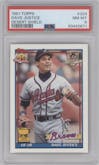 Dave Justice from the 1991 Topps set featuring a Desert Shield parallel graded by PSA and given an overall grade of 8.