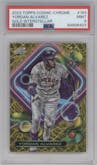 Yordan Alvarez from the 2023 Topps Cosmic Chrome set featuring a Gold Interstellar Refractor parallel graded by PSA and given an overall grade of 9.