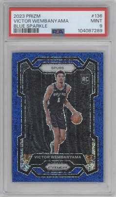 Victor Wembanyama from the 2023-24 Panini Prizm set featuring a Blue Sparkle parallel graded by PSA and given an overall grade of 9.