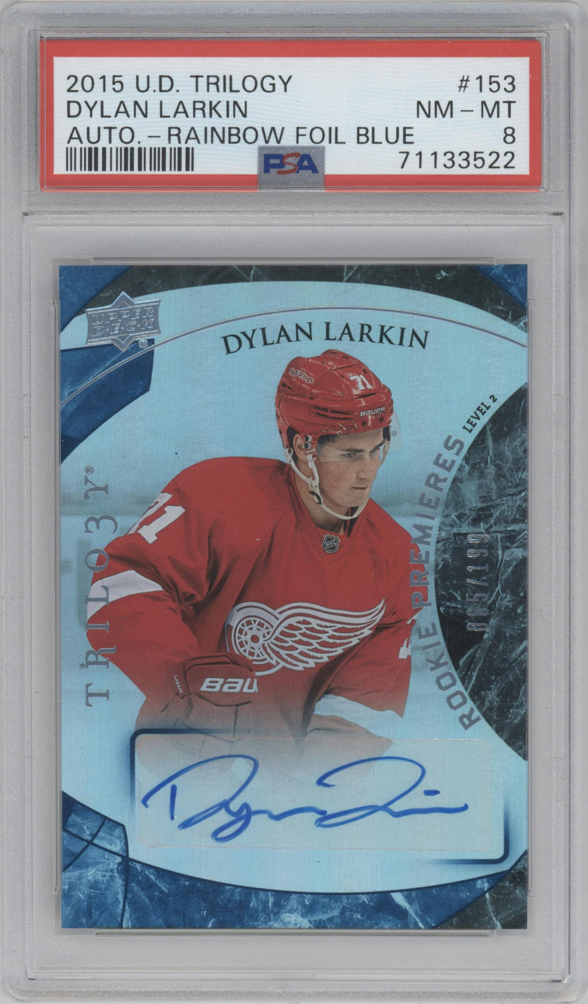 Dylan Larkin from the 2015-16 Upper Deck Trilogy set featuring a Blue Rainbow Foil parallel graded by PSA and given an overall grade of 8.