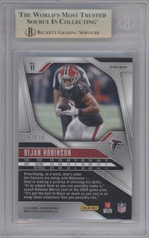 Bijan Robinson from the 2024 Panini Prizm set featuring a Choice Gold parallel graded by Beckett and given an overall grade of 9.5.