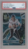 Trevor Lawrence from the 2022 Panini Spectra set featuring a Neon Splatter parallel graded by PSA and given an overall grade of 9.