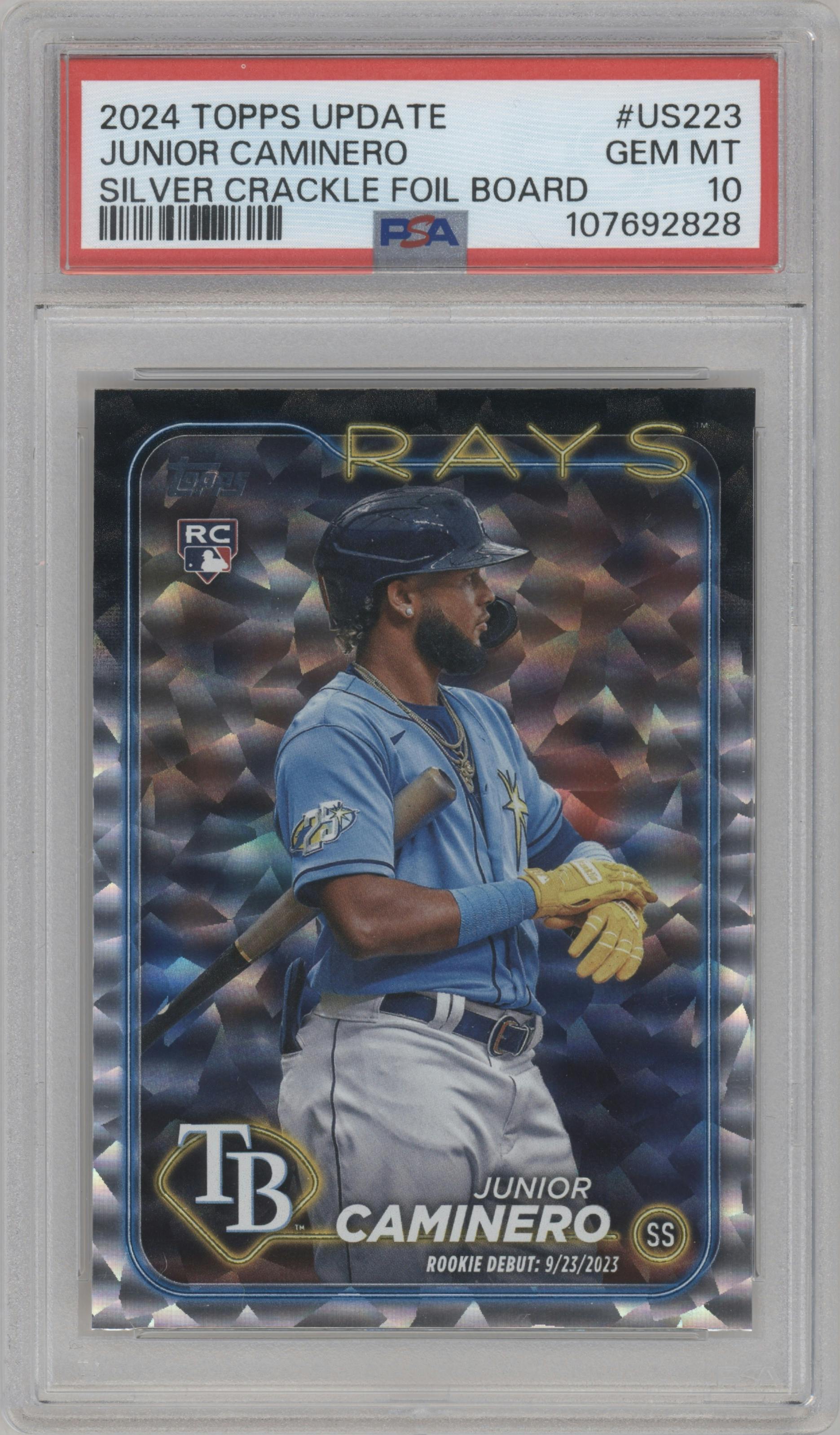 Junior Caminero from the 2024 Topps Update set featuring a Silver Crackle Foilboard parallel graded by PSA and given an overall grade of 10.