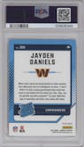 Jayden Daniels from the 2024 Donruss set featuring a Red Pandora parallel graded by PSA and given an overall grade of 9.