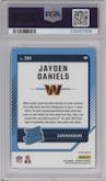 Jayden Daniels from the 2024 Donruss set featuring a Red Wave parallel graded by PSA and given an overall grade of 9.