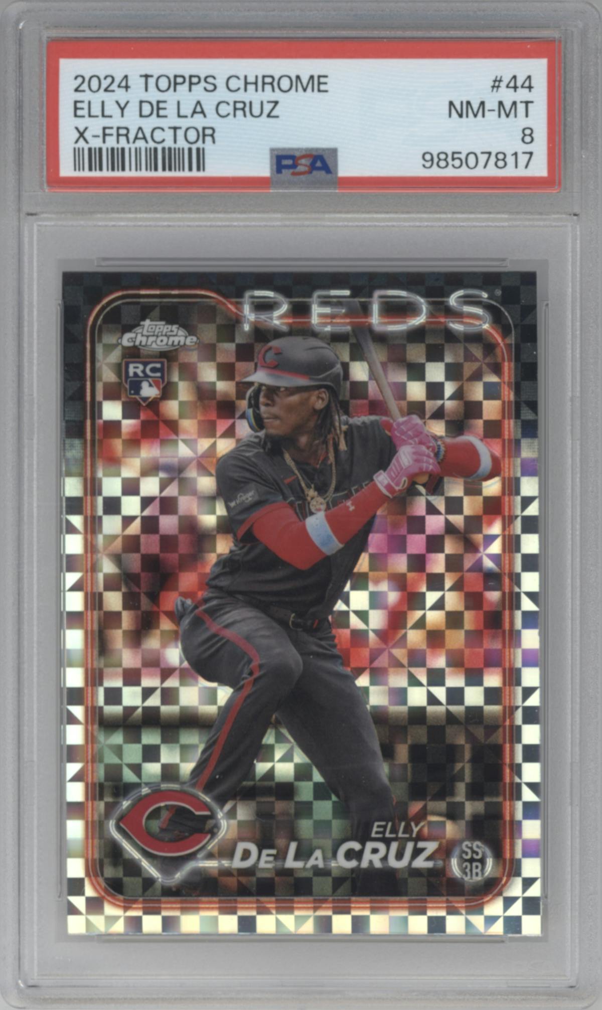 Elly De La Cruz from the 2024 Topps Chrome set featuring a X-Fractor parallel graded by PSA and given an overall grade of 8.