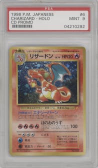 Charizard from the 1998 Pokemon JPN set featuring a CD Promo parallel graded by PSA and given an overall grade of 9.
