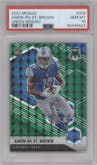 Amon-Ra St. Brown from the 2021 Panini Mosaic set featuring a Green Mosaic parallel graded by PSA and given an overall grade of 10.