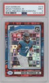 Brian Thomas Jr. from the 2024 Donruss set featuring a Red Pandora parallel graded by PSA and given an overall grade of 9.