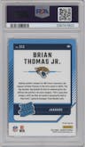 Brian Thomas Jr. from the 2024 Donruss set featuring a Red Pandora parallel graded by PSA and given an overall grade of 9.