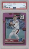 Brock Purdy from the 2022 Panini Donruss Optic set featuring a Pink parallel graded by PSA and given an overall grade of 9.