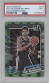 Victor Wembanyama from the 2023-24 Panini Donruss set featuring a Green Holo Laser  parallel graded by PSA and given an overall grade of 9.
