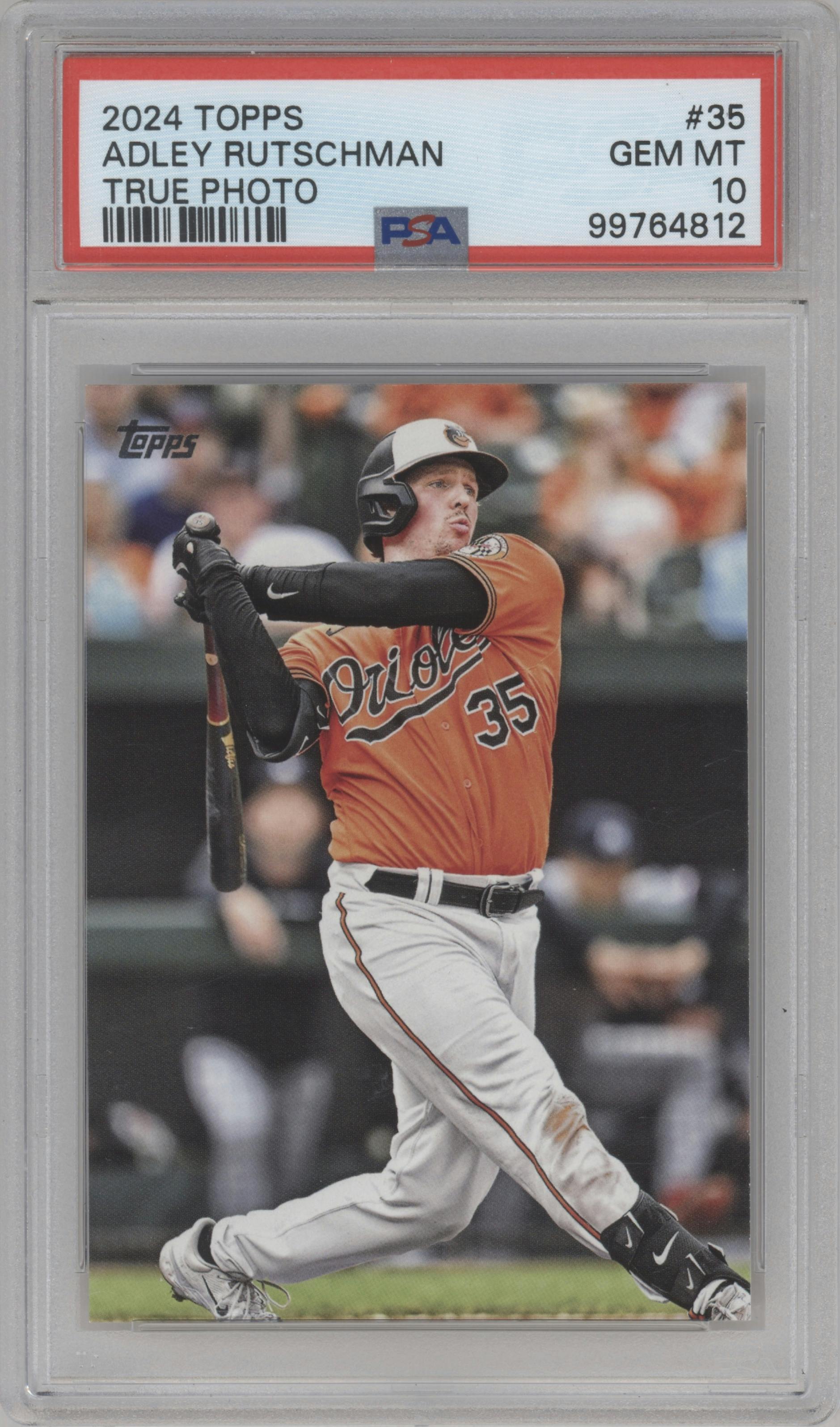 Adley Rutschman from the 2024 Topps  set featuring a True Photo Variation parallel graded by PSA and given an overall grade of 10.