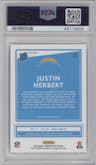Justin Herbert from the 2020 Panini Donruss Optic set featuring a Holo parallel graded by PSA and given an overall grade of 9.