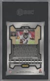 Alvin Kamara from the 2023 Panini Prizm set featuring a Blue Sparkle parallel graded by SGC and given an overall grade of 9.5.