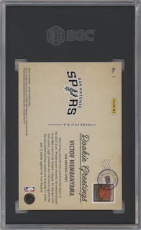 Victor Wembanyama from the 2023-24 Panini NBA Hoops set featuring a Winter Holo parallel graded by SGC and given an overall grade of 9.5.