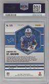 Amon-Ra St. Brown from the 2021 Panini Mosaic set featuring a Reactive Blue parallel graded by PSA and given an overall grade of 10.