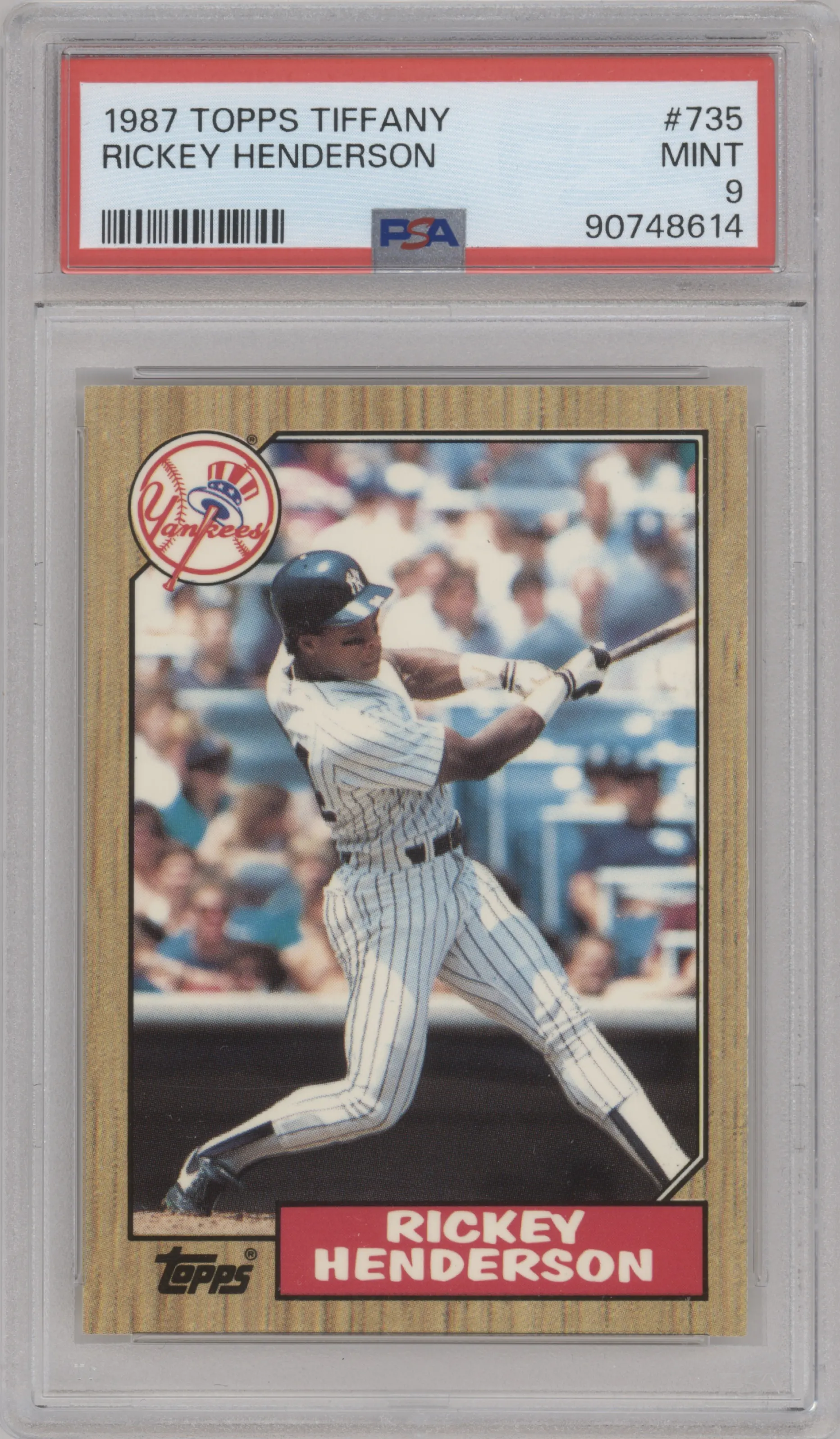 Rickey Henderson from the 1987 Topps set featuring a Tiffany parallel graded by PSA and given an overall grade of 9.