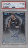 Luka Doncic from the 2023-24 Panini Black set featuring a Platinum parallel graded by PSA and given an overall grade of 9.