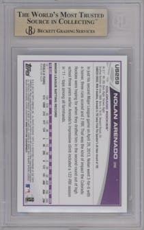 Nolan Arenado from the 2013 Topps Update set featuring a Walmart Blue parallel graded by Beckett and given an overall grade of 9.5.