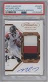 Michael Vick from the 2023 Panini Flawless set featuring a Bronze parallel graded by PSA and given an overall grade of 9.