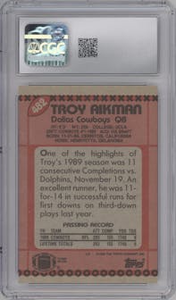 Troy Aikman from the 1990 Topps set graded by CSG and given an overall grade of 9.