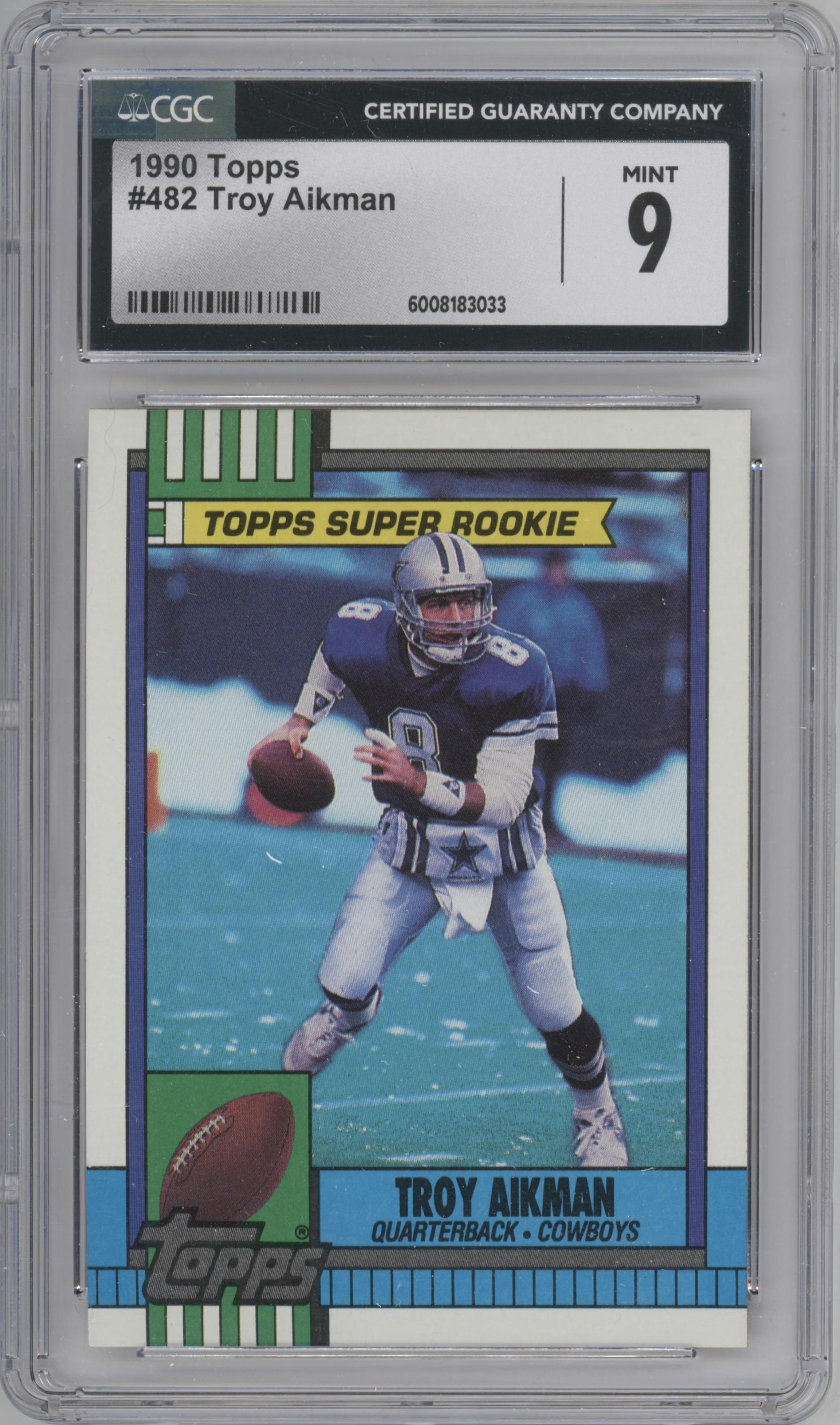 Troy Aikman from the 1990 Topps set graded by CSG and given an overall grade of 9.