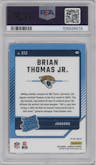 Brian Thomas Jr. from the 2024 Donruss set featuring a Red Pandora parallel graded by PSA and given an overall grade of 9.