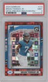 Brian Thomas Jr. from the 2024 Donruss set featuring a Red Pandora parallel graded by PSA and given an overall grade of 9.