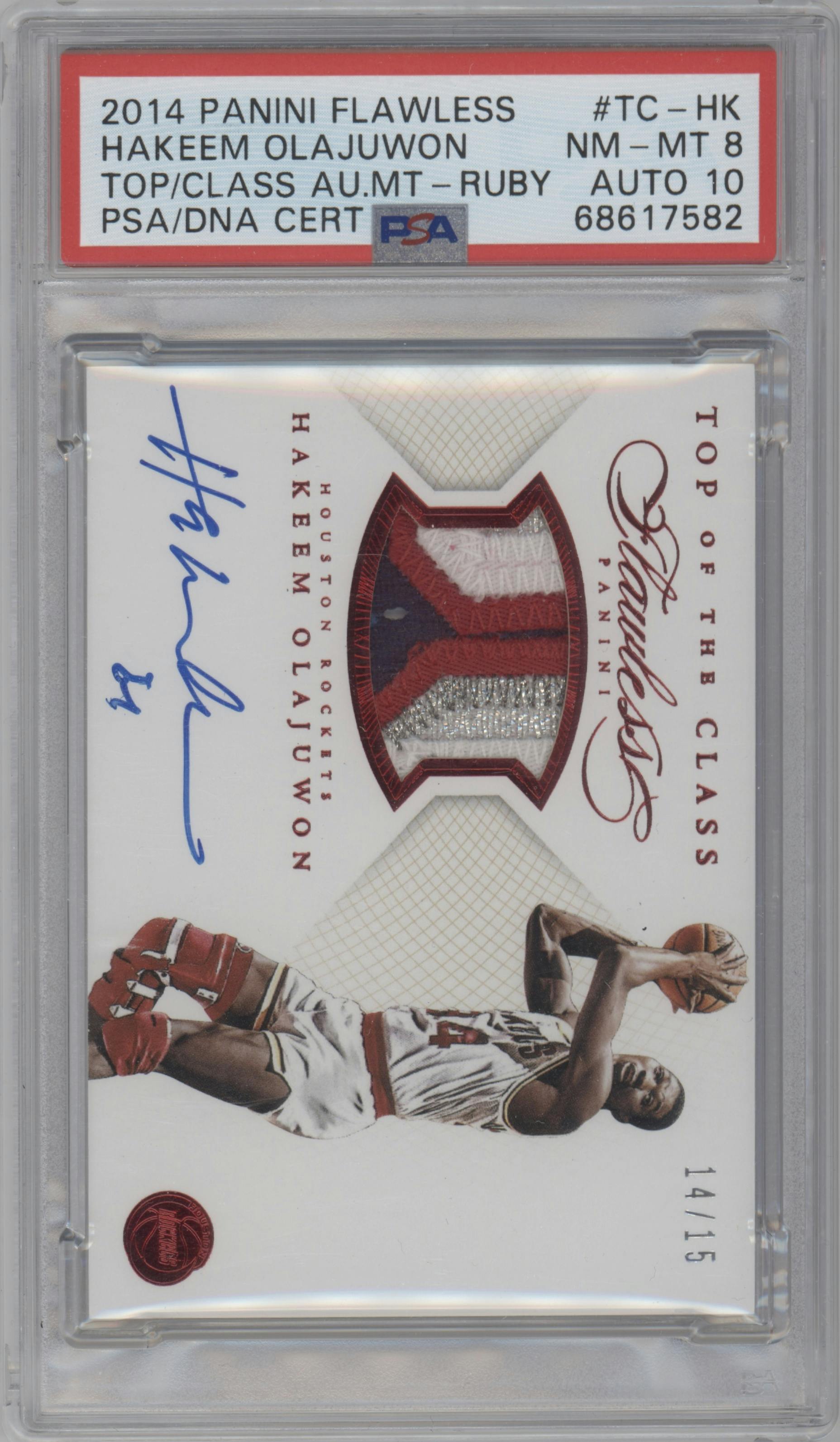 Hakeem Olajuwon from the 2014-15 Panini Flawless set featuring a Ruby parallel graded by PSA and given an overall grade of 8.