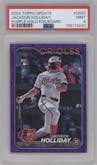 Jackson Holliday from the 2024 Topps Update set featuring a Purple Holofoil parallel graded by PSA and given an overall grade of 9.