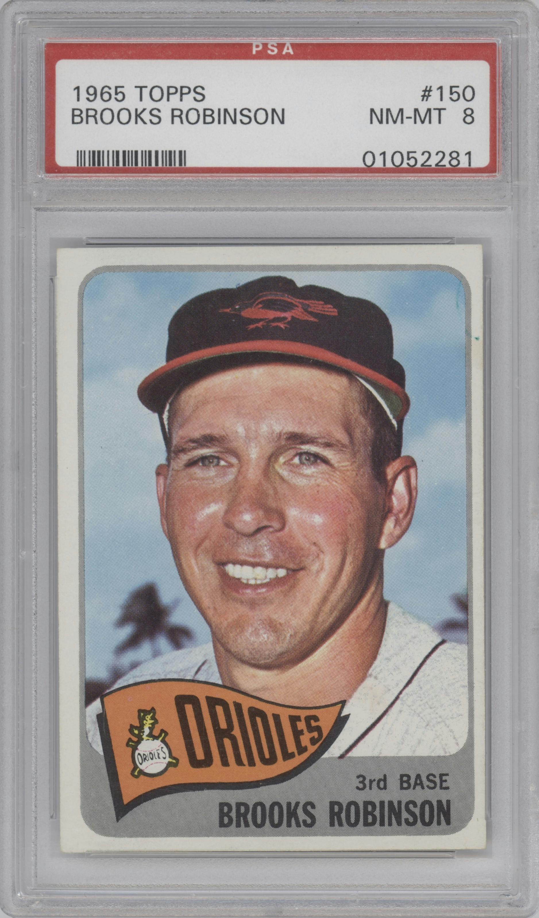 Brooks Robinson from the 1965 Topps set graded by PSA and given an overall grade of 8.