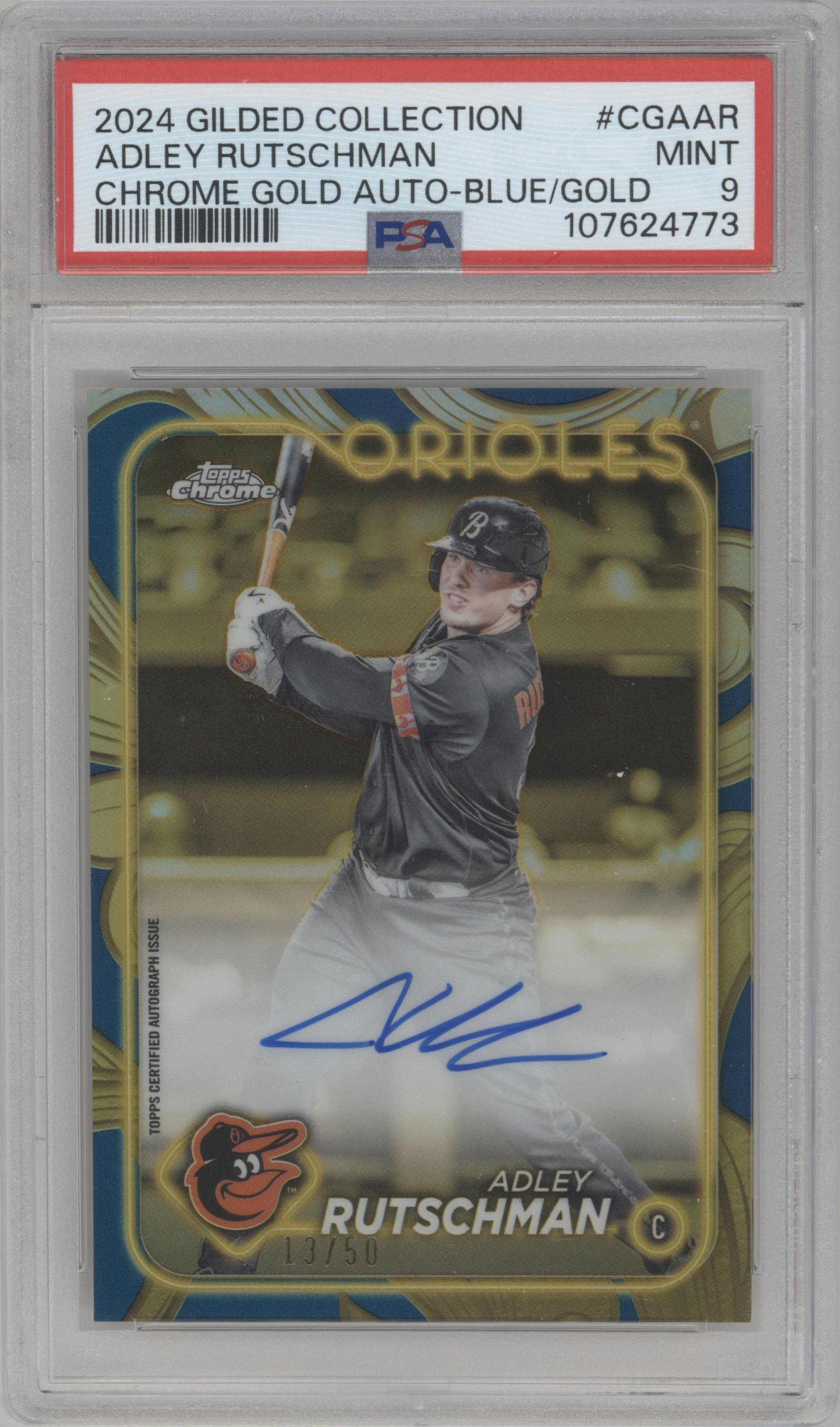 Adley Rutschman from the 2024 Topps Gilded Collection set featuring a Blue/Gold parallel graded by PSA and given an overall grade of 9.