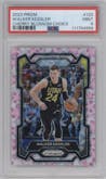 Walker Kessler from the 2023-24 Panini Prizm set featuring a Choice Cherry Blossom parallel graded by PSA and given an overall grade of 9.