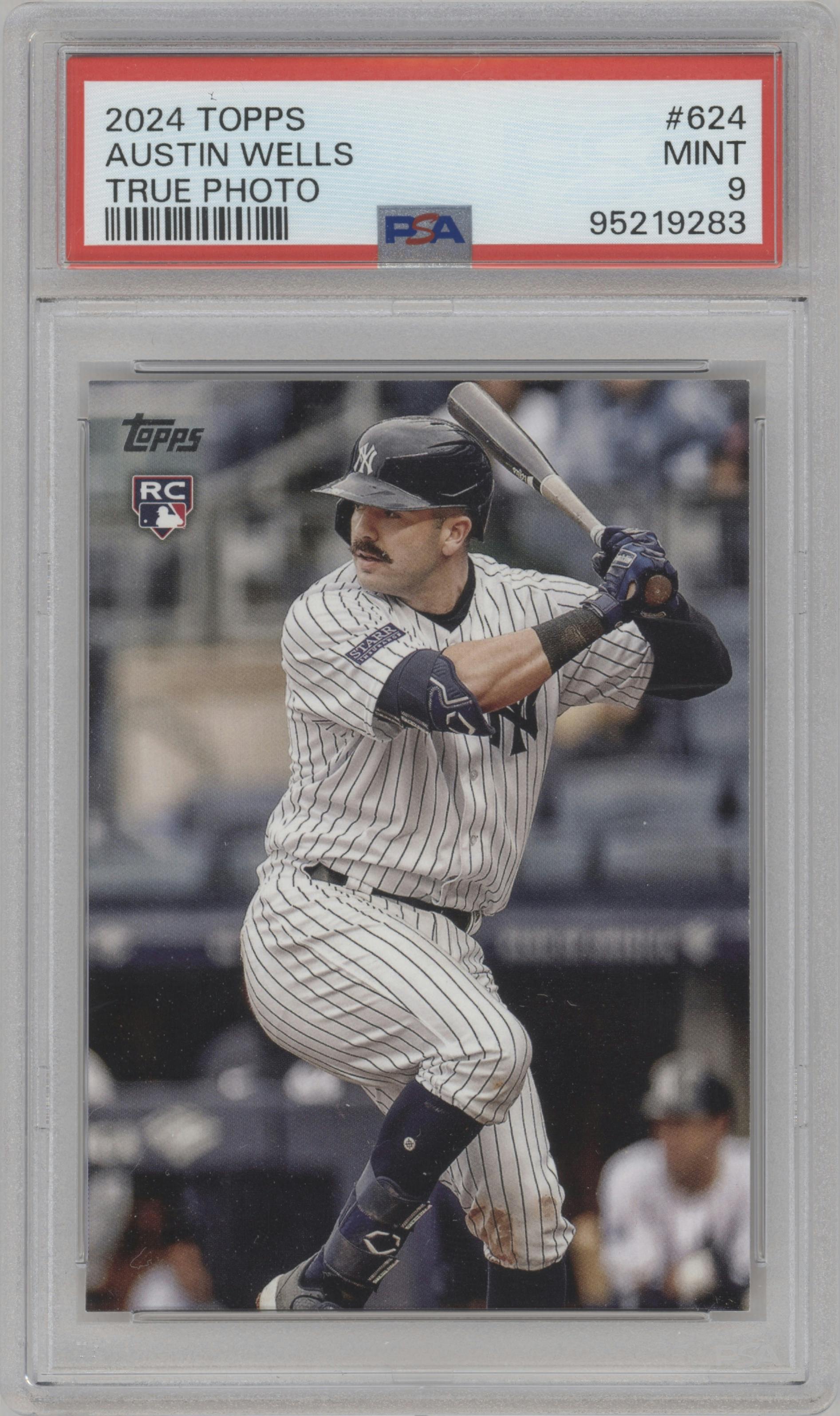 Austin Wells from the 2024 Topps  set featuring a True Photo Variation parallel graded by PSA and given an overall grade of 9.