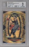 Trae Young from the 2018-19 Panini Select  set featuring a Die-Cut Prizm Neon Orange Pulsar FOTL parallel graded by Beckett and given an overall grade of 9.